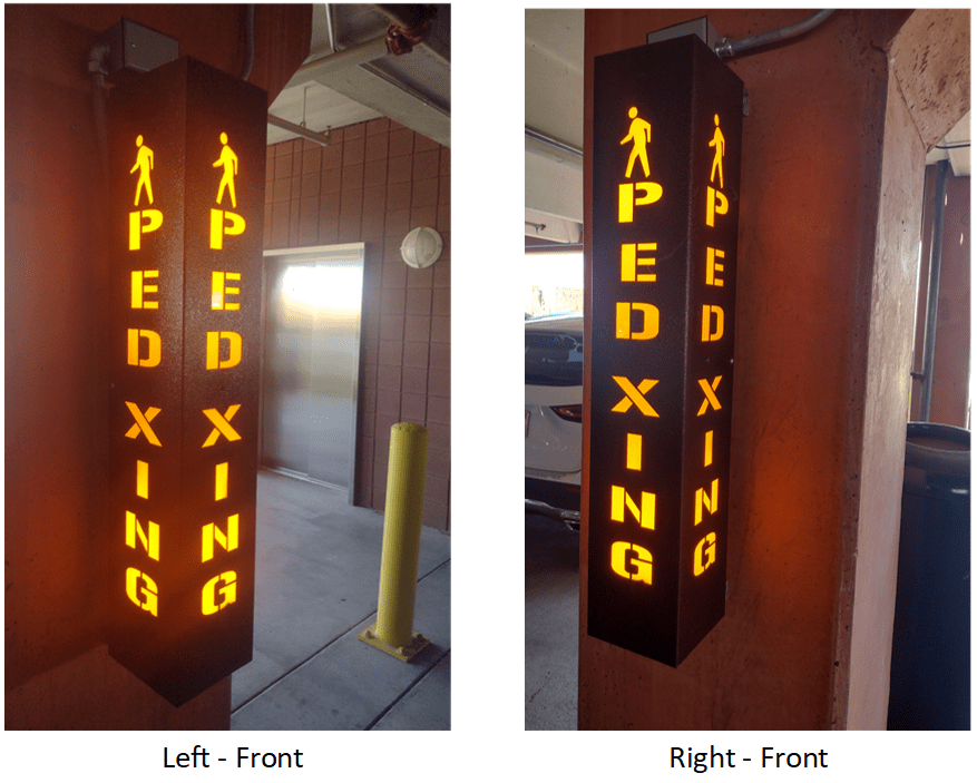 Illuminated PEDXING 3607 pedestrian crossing warning sign installed in a parking garage to improve visibility and alert drivers to pedestrian traffic.
