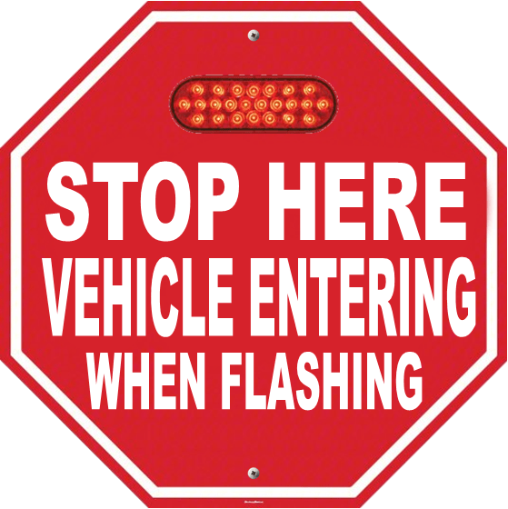 Red octagonal Stop Here Vehicle Entering When Flashing sign with illuminated red LEDs